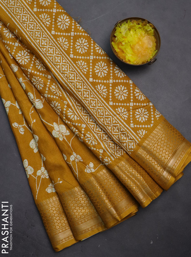 Semi dola saree mustard yellow with allover prints and zari woven border