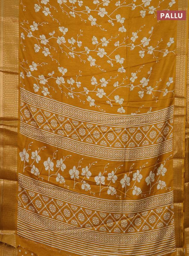 Semi dola saree mustard yellow with allover prints and zari woven border