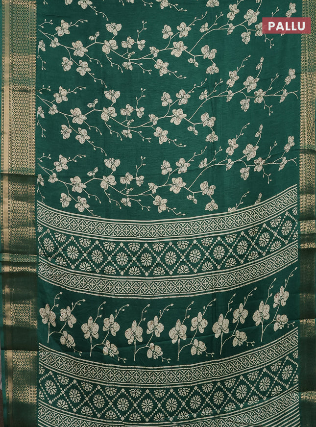 Semi dola saree dark green with allover prints and zari woven border