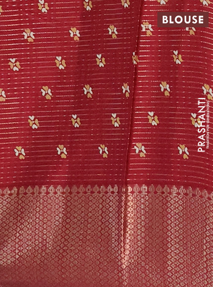 Semi dola saree maroon with allover zari weaves & butta prints and zari woven border