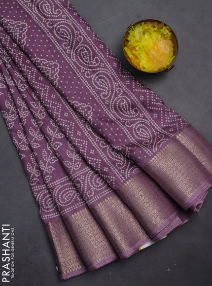 Semi dola saree pastel purple with allover bandhani prints and zari woven border