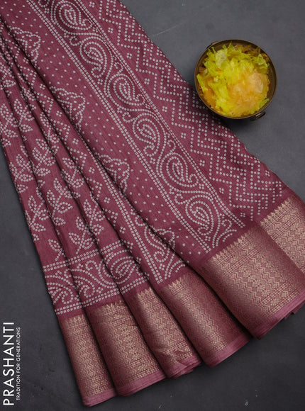 Semi dola saree mauve pink with allover bandhani prints and zari woven border