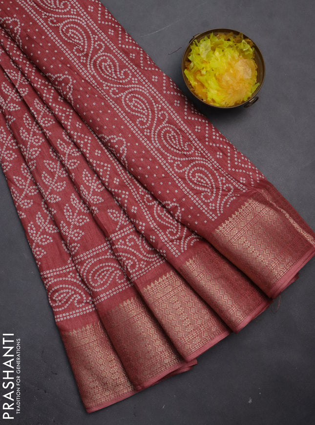 Semi dola saree pastel maroon with allover bandhani prints and zari woven border