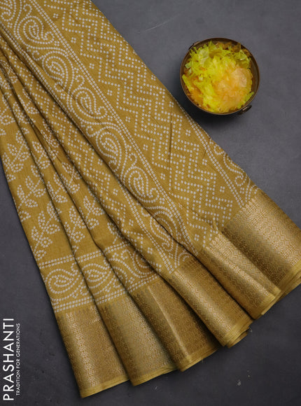 Semi dola saree mustard shade with allover bandhani prints and zari woven border