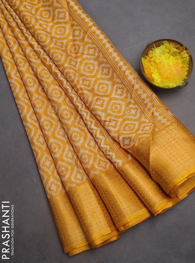 Semi dola saree mustard yellow with allover prints and zari woven border