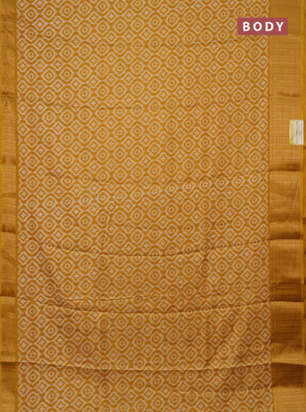 Semi dola saree mustard yellow with allover prints and zari woven border