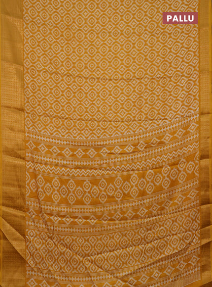 Semi dola saree mustard yellow with allover prints and zari woven border