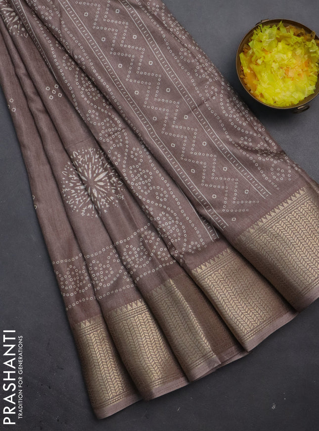 Semi dola saree brown shade with bandhani butta prints and zari woven border