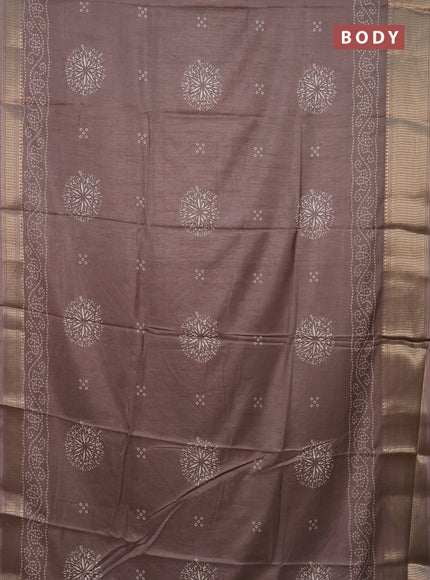 Semi dola saree brown shade with bandhani butta prints and zari woven border