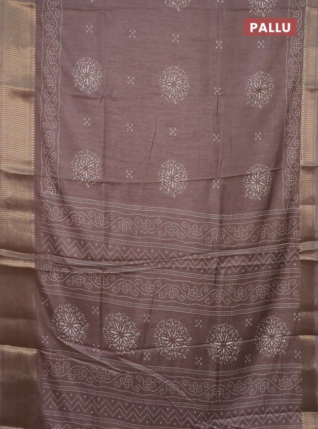 Semi dola saree brown shade with bandhani butta prints and zari woven border