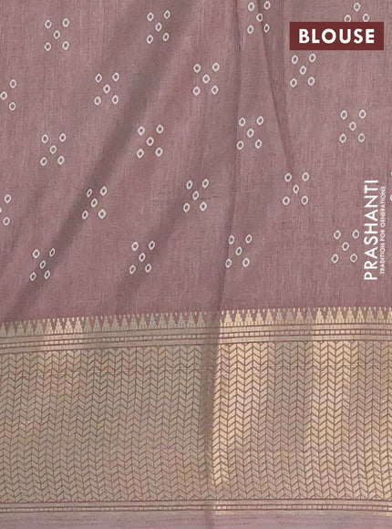 Semi dola saree brown shade with bandhani butta prints and zari woven border