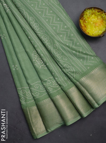 Semi dola saree pastel green with bandhani butta prints and zari woven border