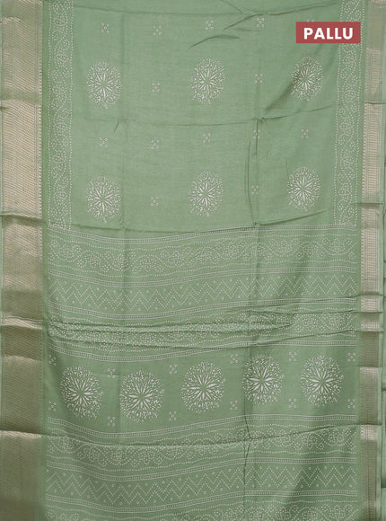 Semi dola saree pastel green with bandhani butta prints and zari woven border