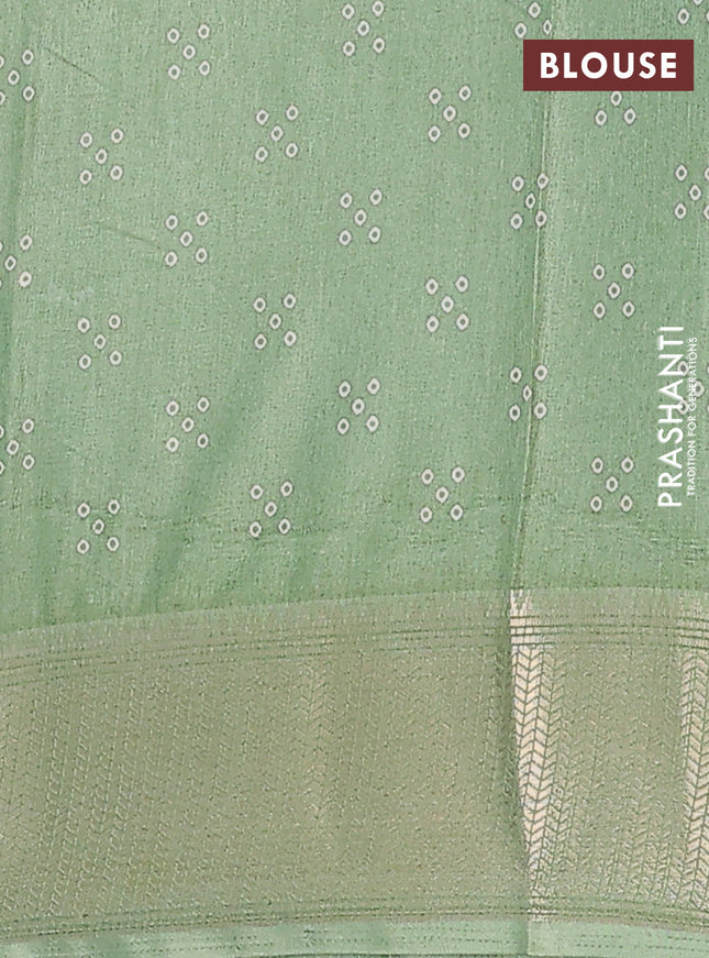 Semi dola saree pastel green with bandhani butta prints and zari woven border