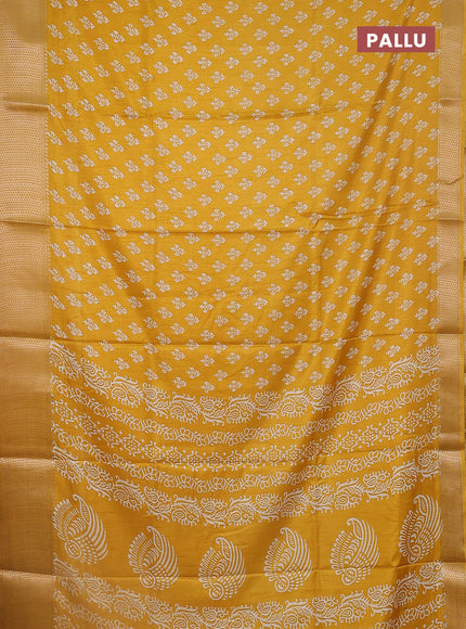 Semi dola saree mustard yellow with butta prints and zari woven border
