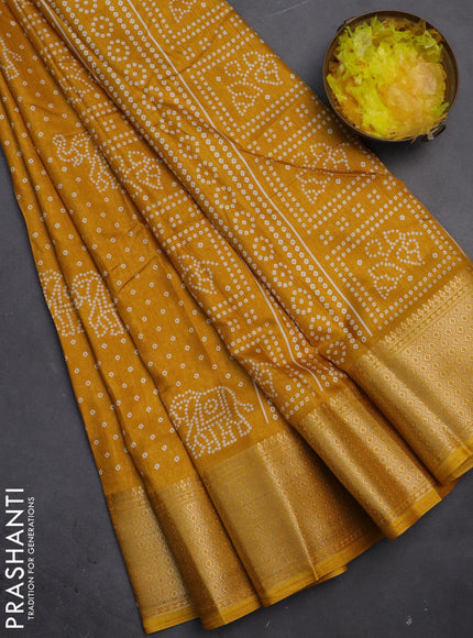 Semi dola saree mustard yellow with bandhani butta prints and zari woven border