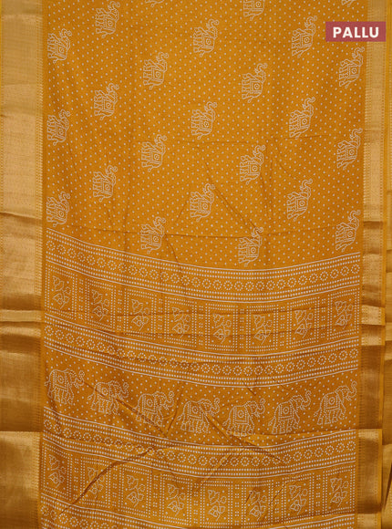 Semi dola saree mustard yellow with bandhani butta prints and zari woven border