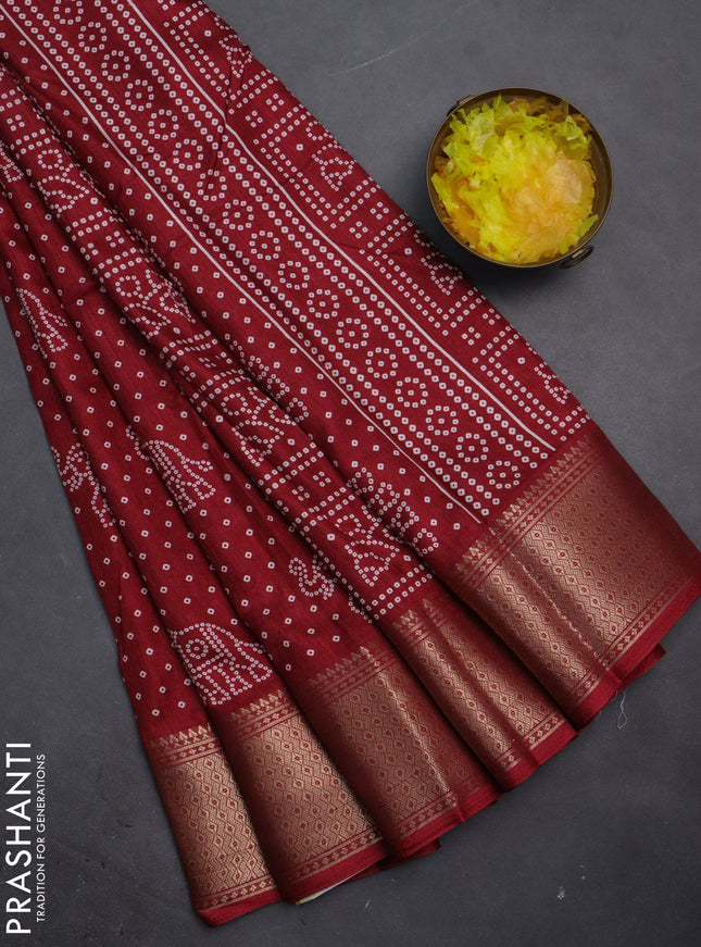 Semi dola saree maroon with bandhani butta prints and zari woven border