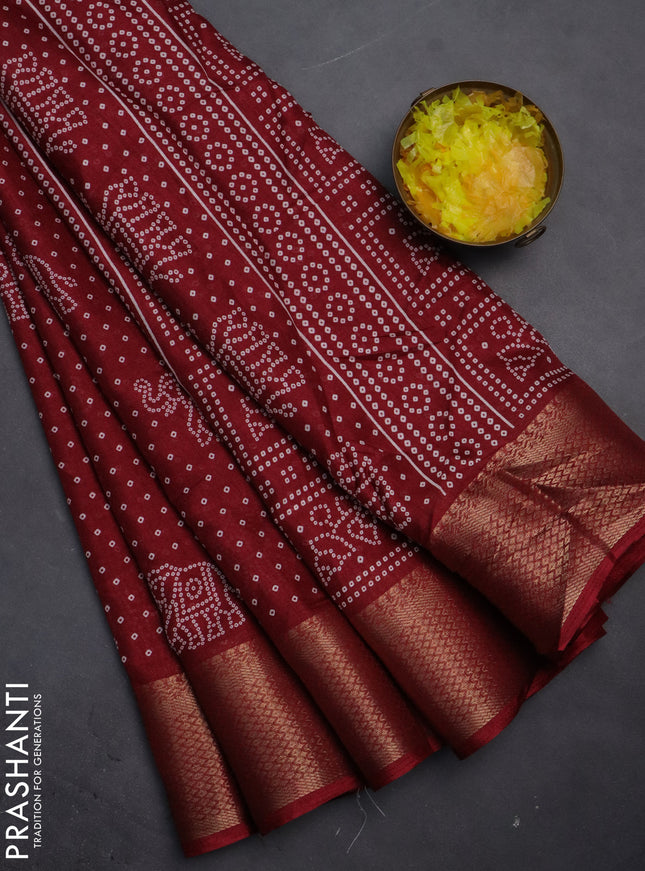 Semi dola saree maroon with bandhani butta prints and zari woven border