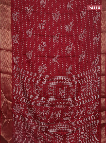 Semi dola saree maroon with bandhani butta prints and zari woven border