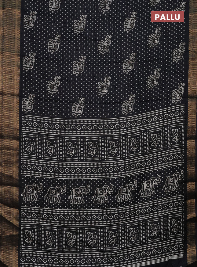 Semi dola saree black with bandhani butta prints and zari woven border