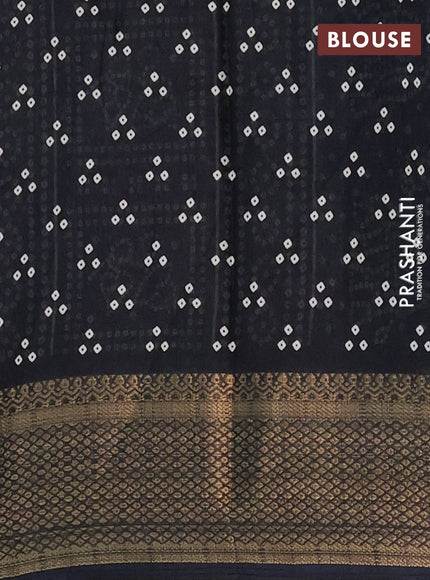 Semi dola saree black with bandhani butta prints and zari woven border