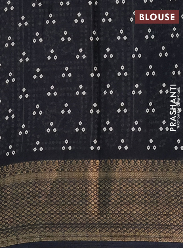 Semi dola saree black with bandhani butta prints and zari woven border