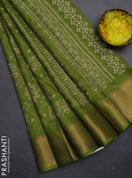 Semi dola saree light green with allover zari stripes & prints and zari woven border