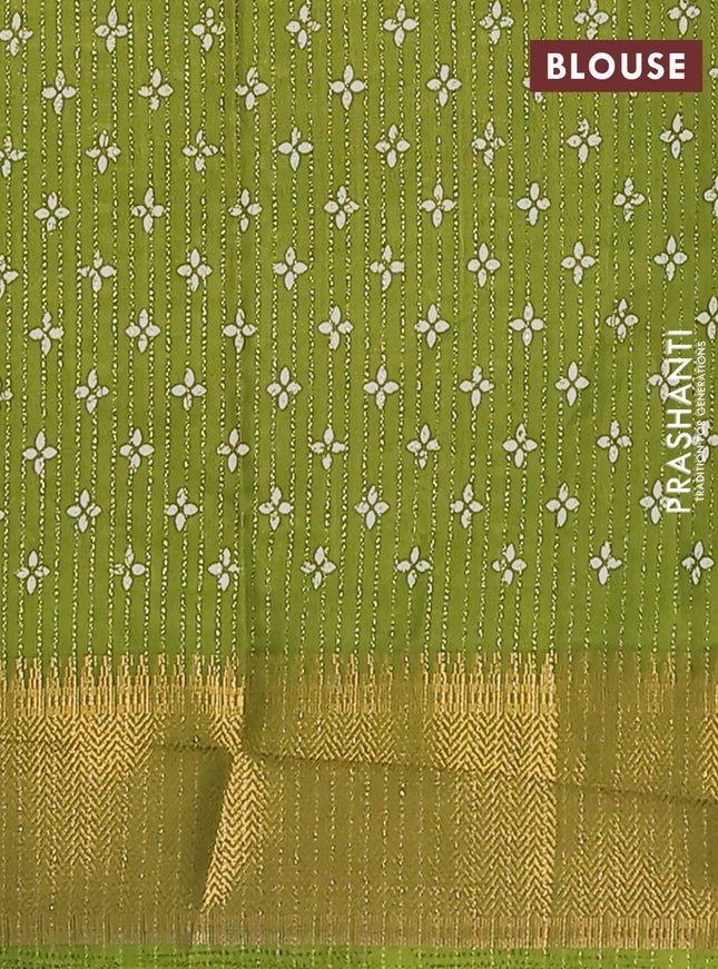 Semi dola saree light green with allover zari stripes & prints and zari woven border