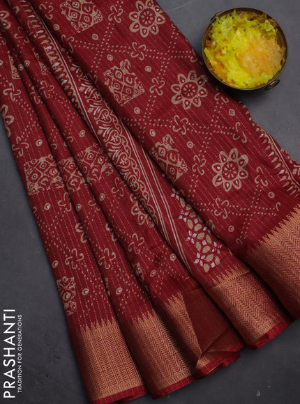 Semi dola saree maroon with allover zari stripes & prints and zari woven border