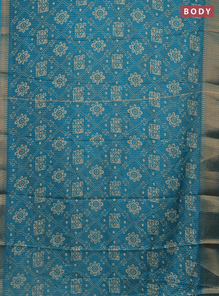 Semi dola saree teal blue with allover zari stripes & prints and zari woven border