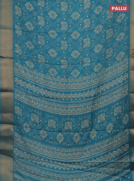 Semi dola saree teal blue with allover zari stripes & prints and zari woven border