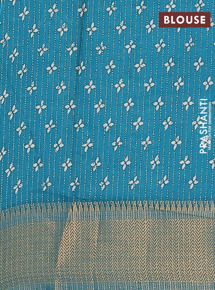 Semi dola saree teal blue with allover zari stripes & prints and zari woven border