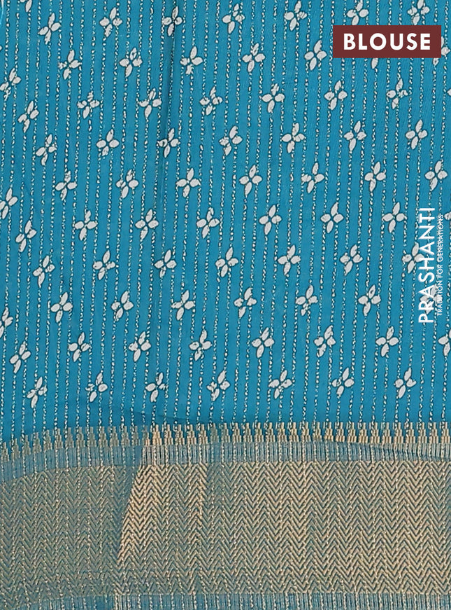 Semi dola saree teal blue with allover zari stripes & prints and zari woven border