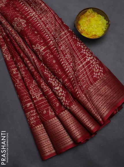 Semi dola saree maroon with allover zari stripes & prints and zari woven border
