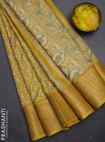Semi dola saree mustard yellow with allover prints and zari woven border
