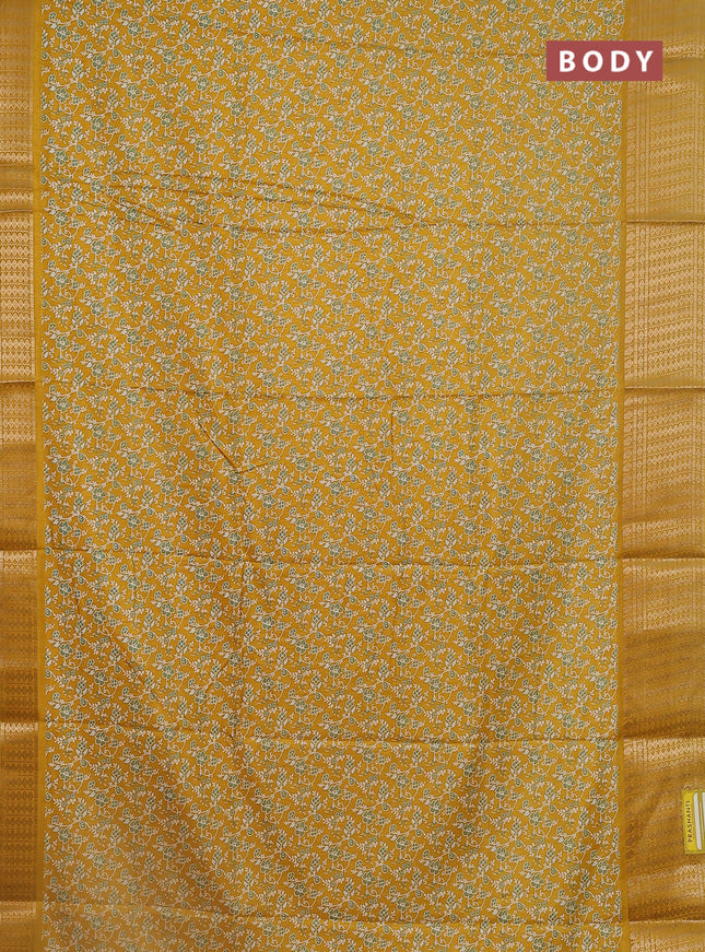 Semi dola saree mustard yellow with allover prints and zari woven border