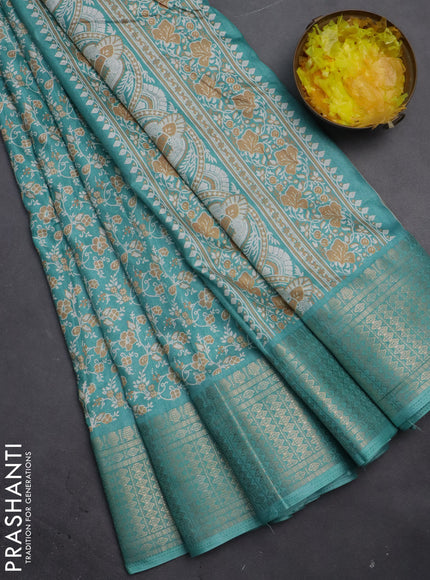 Semi dola saree teal blue shade with allover prints and zari woven border