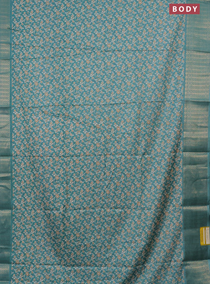 Semi dola saree teal blue shade with allover prints and zari woven border