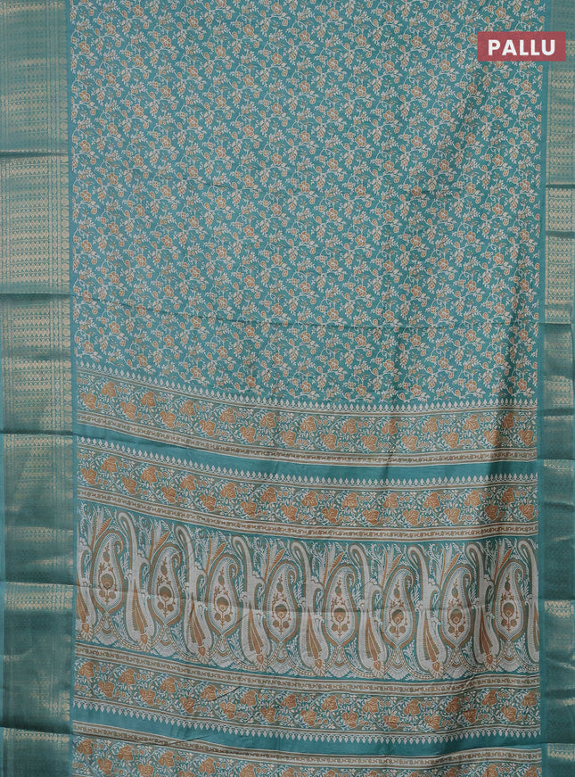 Semi dola saree teal blue shade with allover prints and zari woven border
