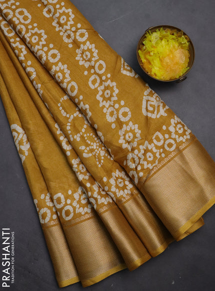 Semi dola saree mustard yellow with batik butta prints and zari woven border
