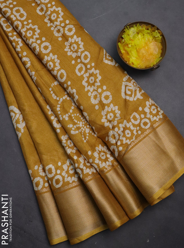 Semi dola saree mustard yellow with batik butta prints and zari woven border