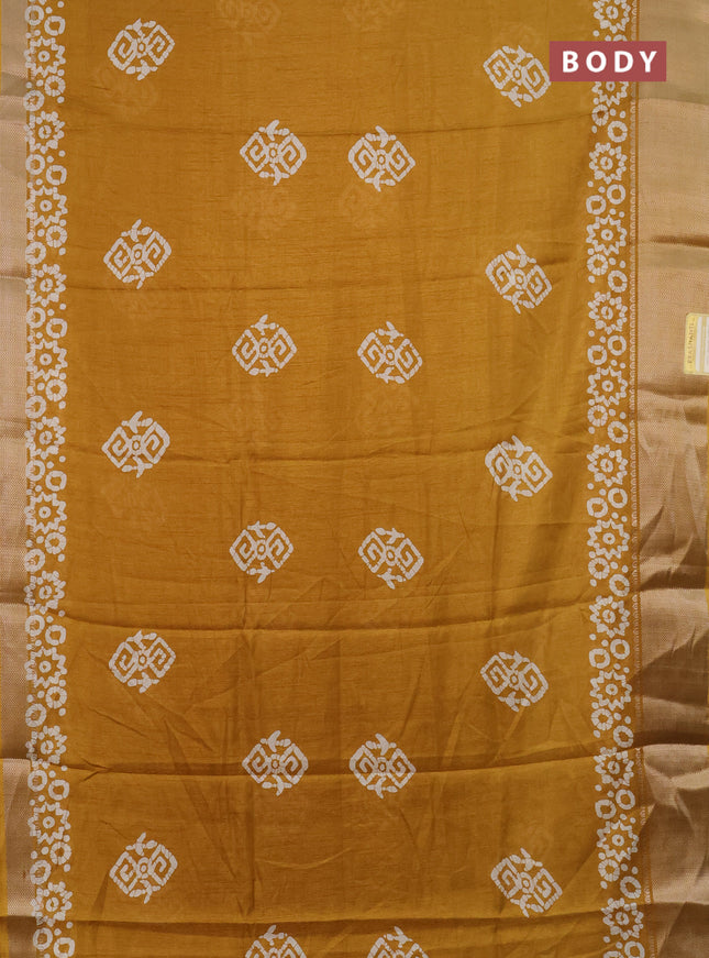 Semi dola saree mustard yellow with batik butta prints and zari woven border