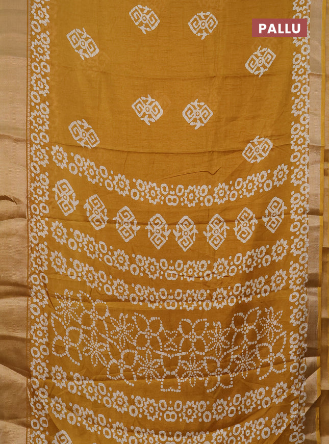 Semi dola saree mustard yellow with batik butta prints and zari woven border