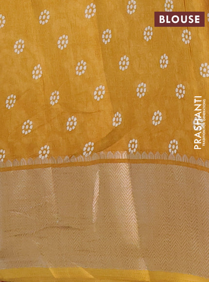 Semi dola saree mustard yellow with batik butta prints and zari woven border