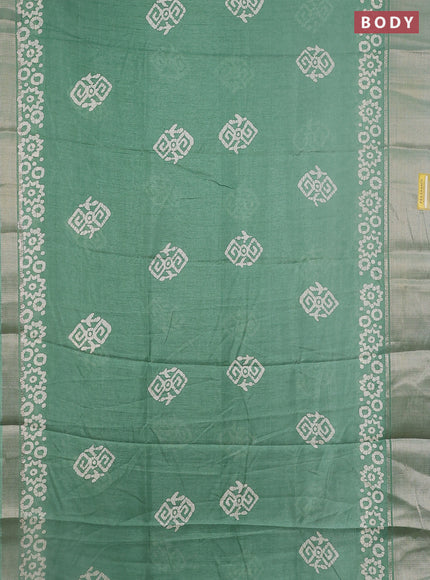 Semi dola saree pastel green with batik butta prints and zari woven border