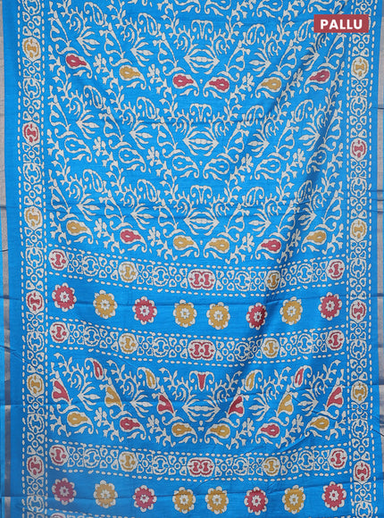 Semi dola saree cs blue with allover batik prints and zari woven border