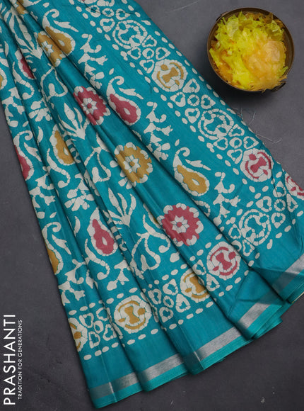 Semi dola saree teal blue with allover batik prints and zari woven border
