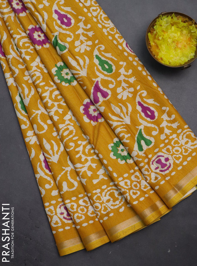 Semi dola saree mustard yellow with allover batik prints and zari woven border
