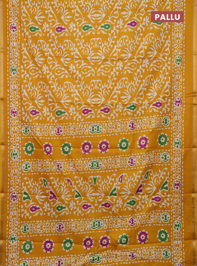 Semi dola saree mustard yellow with allover batik prints and zari woven border
